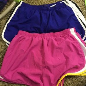 Pink and blue Nike running shorts